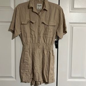 Brand new tan colored romper.